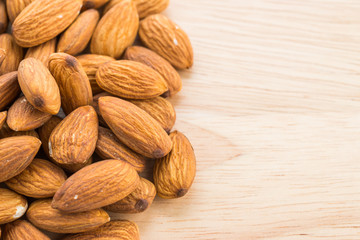 Almond on wooden background