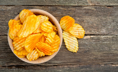 potato chips in a wooden bowl