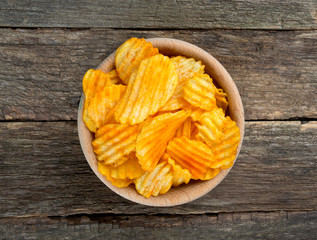 potato chips in a wooden bowl