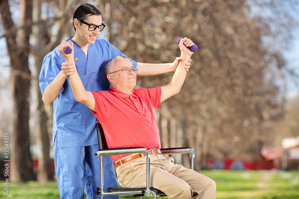 Wall mural physiotherapist exercising with a patient in park