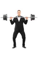 Fototapeta na wymiar Elegant man holding a heavy weight