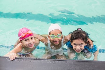Cute little kids in the swimming pool