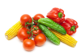Fototapeta na wymiar tomatoes, cucumbers, corn and sweet peppers on a white backgroun