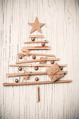 Christmas tree made of wooden branches with gift box