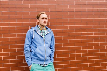 Young bearded man in casual wear with wooden bowtie