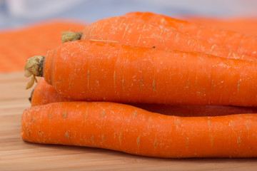 Fresh carrot on a wooden table