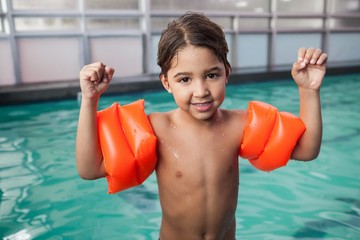 Little boy smiling at the pool