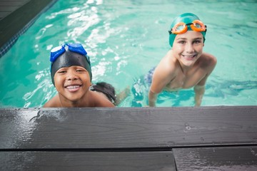 Little boys smiling in the pool