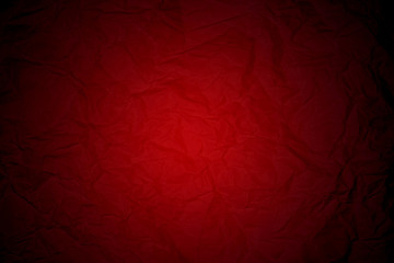 red wrinkled sheet of paper with black vignette borders