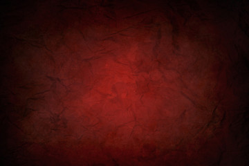 red dirty and wrinkled sheet of paper with black vignette border