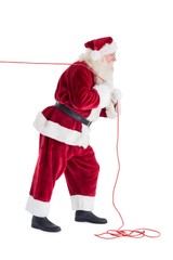 Santa pulls something with a rope