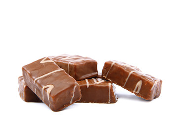 Chocolate candies on white background.