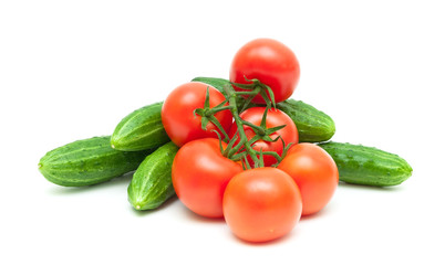 bunch of tomatoes and cucumbers isolated on white background