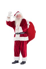 Santa waves to the camera