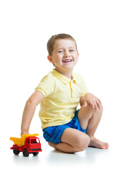 kid boy playing with toy car