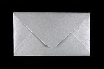 silver envelope on black background