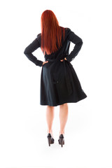 model isolated on plain background back hands on hips
