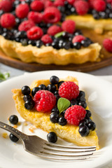 custard tart with raspberries and blueberries
