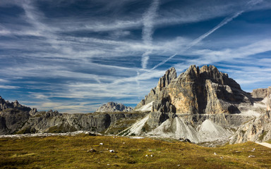 Airplane trails over Dolomites