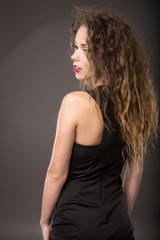 Naklejka premium elegant fashionable woman in black dress