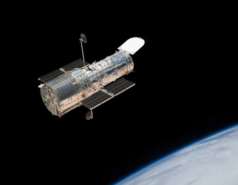 Hubble Space Telescope in orbit above the Earth.
