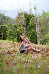 Naklejka na ściany i meble Young woman posing in Koh Samui jungle. Thailand