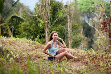 Naklejka na ściany i meble Young woman posing in Koh Samui jungle. Thailand