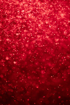 abstract bloody red background with bokeh particles