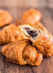 bite croissants with chocolate, closeup