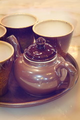 Set of Brown ceramic tea pot and ceramic tea cup