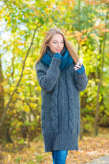 Young woman walking in an autumn park