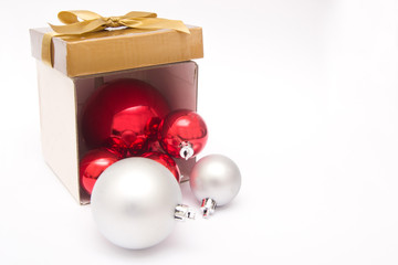 Christmas balls out of a gift box