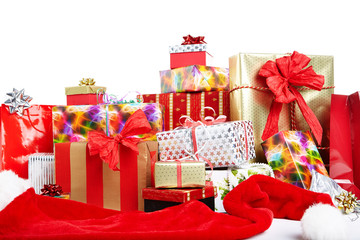 A pile of Christmas gifts in colorful wrapping with ribbons.