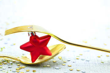 Christmas golden cutlery and  on festive background © viperagp