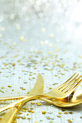 Christmas golden cutlery on festive background © viperagp