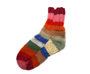 Obraz na płótnie Canvas Warm knitted woolen sock knitting needles isolated on a white ba