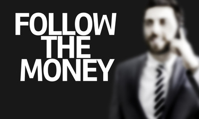 Business man with the text Follow the Money
