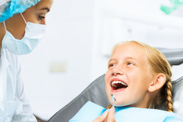 Fototapeta premium Dentist inspecting patient