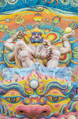 God of mythology sculpture on sanctuary entrance