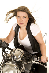Obraz na płótnie Canvas woman black vest motorcycle wind lean forward