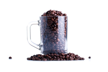 coffee beans in a glass cup isolated on white background