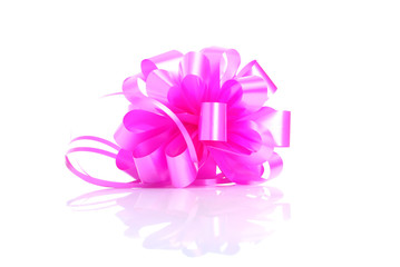 pink gift bow isolated on white background with reflection