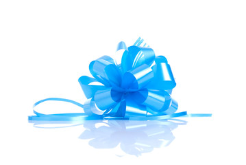 Blue gift bow isolated on white background with reflection