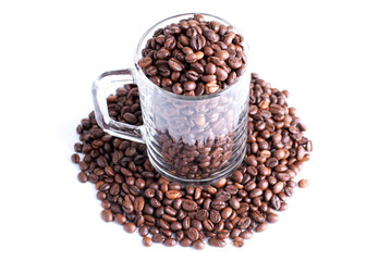 coffee beans in a glass cup isolated on white background