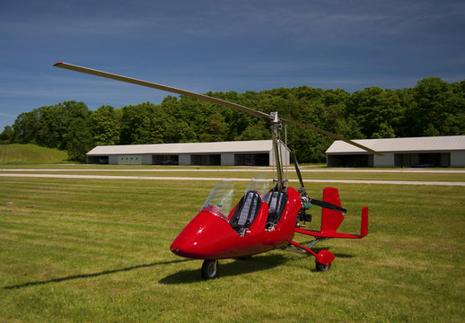 Red open-cockpit autogyro