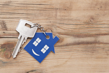 Keychain figure of house and key close up