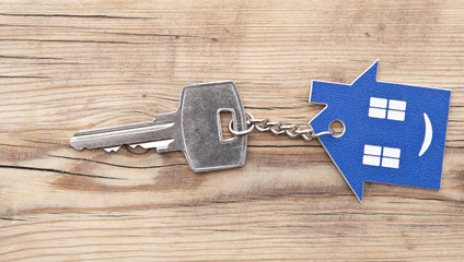 Keychain figure of house and key close up