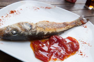 Grilled fish with tomato