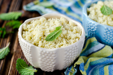 Cous cous with herbs in a ceramic bowl
