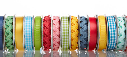 colorful ribbon rolls on white